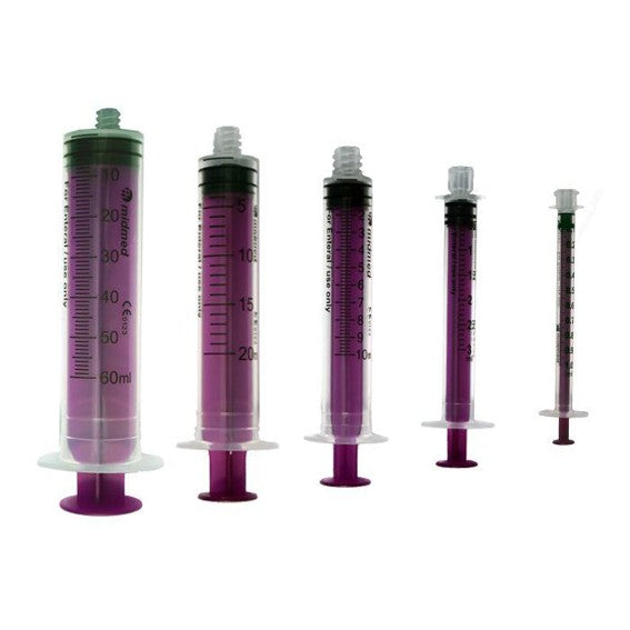 Set of five purple syringes with measurement markings on a white background