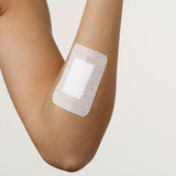 Asguard Non-Woven Island Dressings in sterile packaging, showcasing adhesive border and assorted sizes for effective wound care