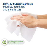 A woman holds Medline's Remedy phtoplex barrier wipes for skin protection and care.