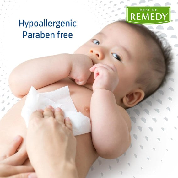 A woman using a Medline's Remedy phtoplex barrier wipe on a baby, showcasing their hypoallergenic characteristic