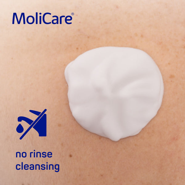 Visual of Molicare spray bottle illustrating walnut-sized application, suitable for skin cleansing in urinary and faecal incontinence