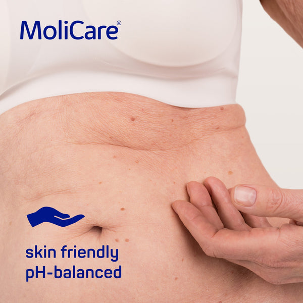 Image depicting an elderly person's stomach, showcasing healthy skin after using MoliCare Skin Cleansing Foam, dermatologically approved