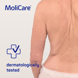 Image depicting an elderly person's back, showcasing healthy skin after using MoliCare Skin Cleansing Foam, dermatologically approved